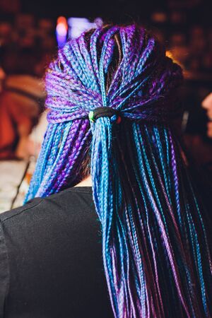 Dreadlocks African pigtails on a white background weaves a master hairdresser in the salon, hair close-ups are braided in dreadlocks plaits copy space background texture.の写真素材