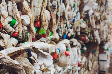 Plastic bales of juice cartons at waste processing plant. Concept of separate garbage collection and reuse.の写真素材