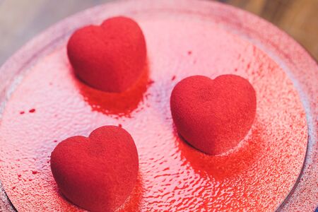 Confectioner decorates the cake with velour using the spray gun.の写真素材