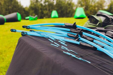 many Bow for shooting and arrows on the table for training in shooting against the background of the...