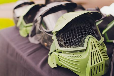 black and green paintball helmet. Mask, a helmet for a game in a paintball.の写真素材