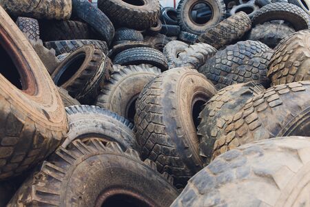 Ufa, Russia, 1 July, 2019: A lot of Wheel Tires dumped in a landfill.
