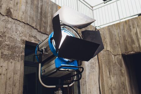 Spotlight with directional light with a Fresnel lens, halogen lamp and protective shutters.の写真素材