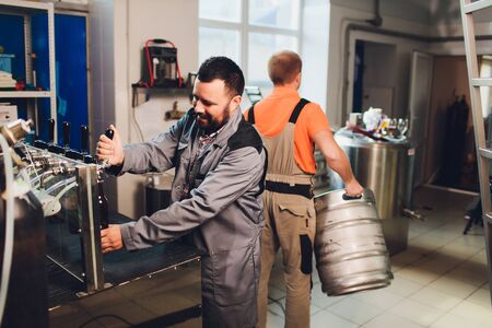 Portrait of brewer who is making beer on his workplace in the brew-house..の写真素材