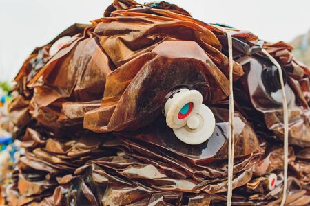 Plastic pressed bales at the modern waste hazardous processing plant. Separate garbage collection. Recycling and storage of waste for further disposal. Business for sorting and processing of waste.の写真素材