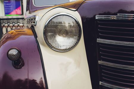 Retro styled image of a front of a classic car.