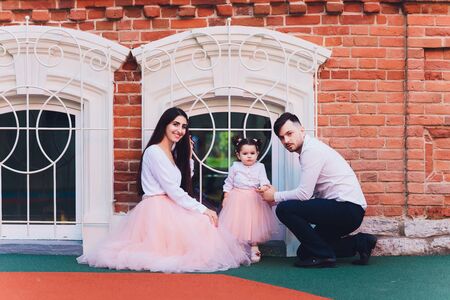 Happy Family enjoying family time together in the park.の写真素材