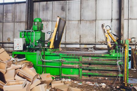 Special equipment for pressing paper waste at a waste sorting plant for further disposal or recycling.の写真素材