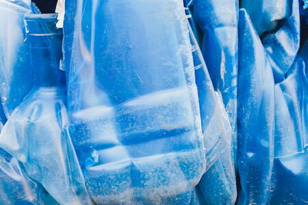 Plastic pressed bales at the modern waste hazardous processing plant. Separate garbage collection. Recycling and storage of waste for further disposal. Business for sorting and processing of waste.の写真素材