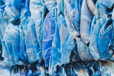 Plastic pressed bales at the modern waste hazardous processing plant. Separate garbage collection. Recycling and storage of waste for further disposal. Business for sorting and processing of waste.の写真素材