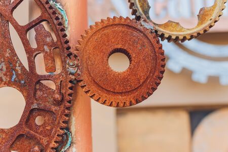 Mechanical collage made of clockwork gears rust.の写真素材
