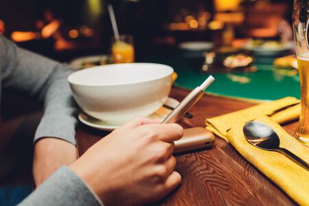 heat-not-burn tobacco product technology. e-cigarette before smoking.
