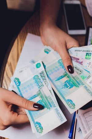 Russian rubles in the hands of a business woman.