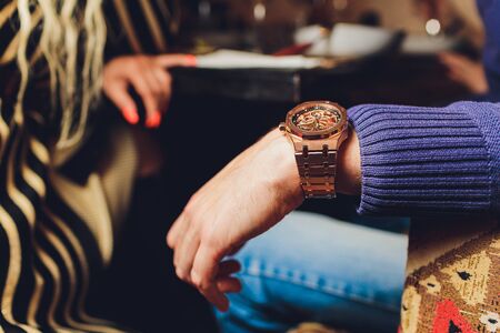 Confident with their choice. Part of young women with perfect legs keeping their legs crossed at knee while sitting on sofa at the shoe store.の写真素材