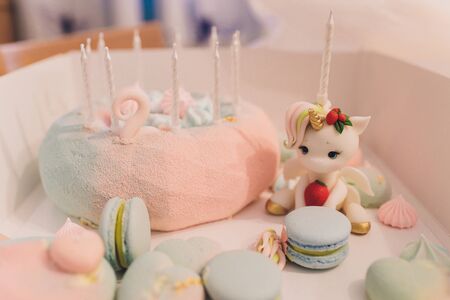 Cake birthday girl with figure, figure rainbow and unicorn.の写真素材