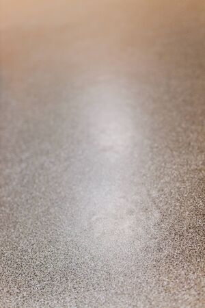 Closeup of tiled linoleum floor. Excellent as background for websites or as texture. selective focus