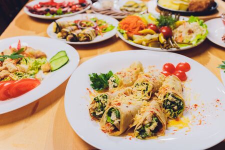 Food Table Celebration Delicious Party Meal Concept. A lot of food. Served for wedding, anniversary, other holiday. Banquet dishes in the restaurantの写真素材