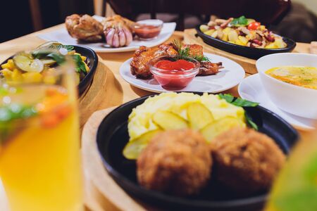 Dining table with a variety of snacks and salads. Salmon, olives, wine, vegetables, grilled fish toast. The concept of a family celebratory dinner. Thanksgiving, Christmas. top veiwの写真素材