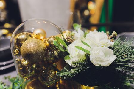 Gold Christmas background of de-focused lights with decorated treeの写真素材