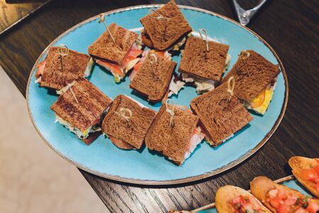 Mini Club Sandwich with chicken beacon ham, Egg Salad Cold Cuts Brioche Sandwiches for Catering, Seminar, Coffee Break, Breakfast, Lunch, Dinner, Buffet and meeting Groupの写真素材