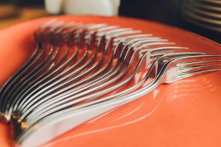 spoons, chopsticks, and plates set in buffet
