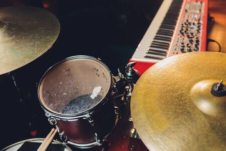 drum set in dramatic light on a black background