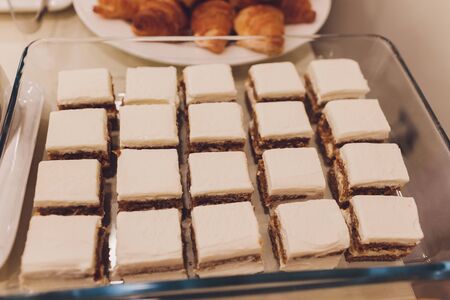 Many banana muffins. stack of banana muffins on a black plate closeup. Banana Cupcake Delicious...