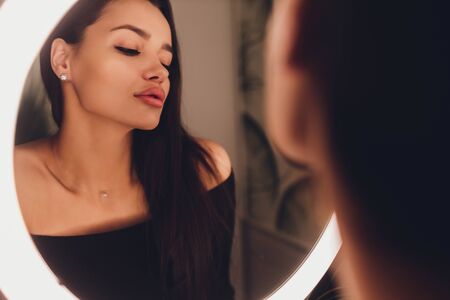 The woman in the toilet. bathroom of a restaurant.の写真素材