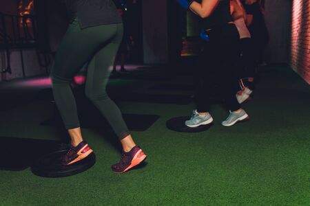 fitness, sport, training, gym and lifestyle concept - group of women working out in gym