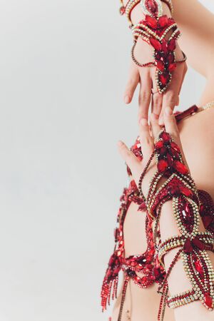 Pretty girl in pink oriental costume dancing belly-dance.