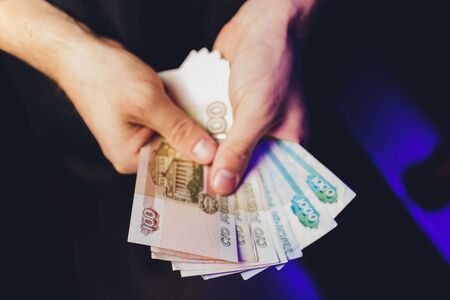 Russian rubles in the hands of a business woman.の写真素材