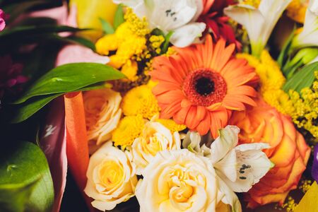 Flowers frame on white wooden background. Top view with copy spaceの写真素材