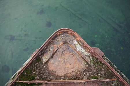 Cemetery of old ships Teriberka Murmansk Russia, wooden remains of industrial fishing boats in sea....