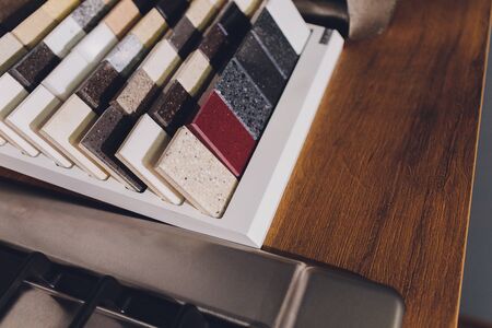 home furnishing store demonstrating variants of stone for kitchen countertop