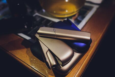 smoking modern hybrid cigarette device heat-not-burn tobacco product technology.の写真素材