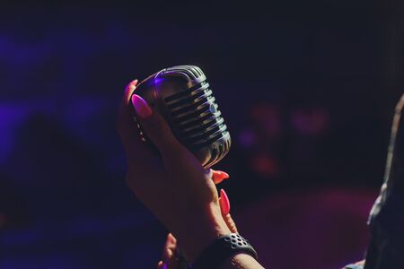 Lets sing Stylish retro microphone on a colored background.の写真素材