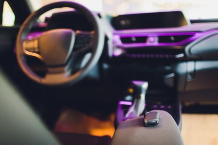 Dark luxury car Interior - steering wheel, shift lever and dashboardの写真素材