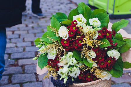 beautiful bouquet of bright flowers in basket
