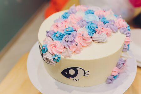 Cake birthday girl with figure, figure rainbow and unicornの写真素材