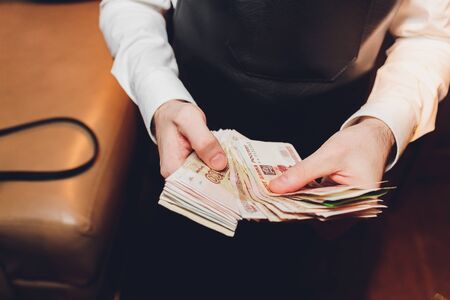 Russian rubles in the hands of a business woman