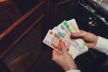 Russian rubles in the hands of a business woman.