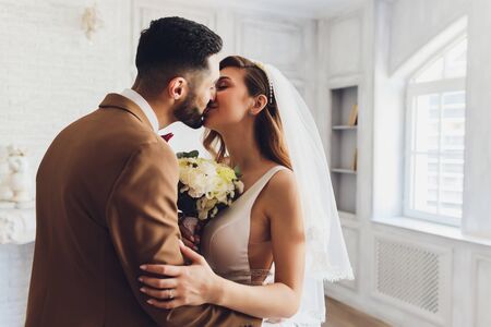 The bride and groom on their wedding day. Engagement of newlyweds. Girl in wedding dress.の写真素材