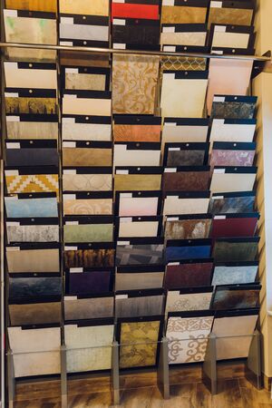 Interior designer's workplace. Architectural project architectural plan, color swatches at the desk