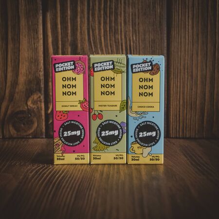 Ufa, Russia, Vape Shop, 1 July, 2019: E-liquid e-juice High vape for electronic cigarette vaping device , on counter in smoke vapor in vape bar in bottles.のeditorial素材