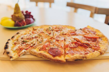 Delicious italian pizza served on wooden table