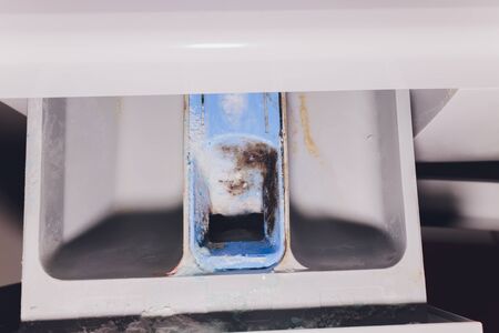 Tray for washing powder in the washing machine dirty dampの写真素材