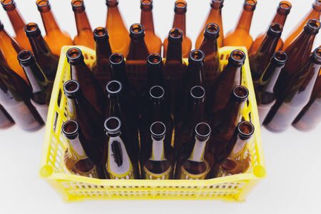 Close-up of beer bottles, focus on middle one, isolated on white backgroundの写真素材