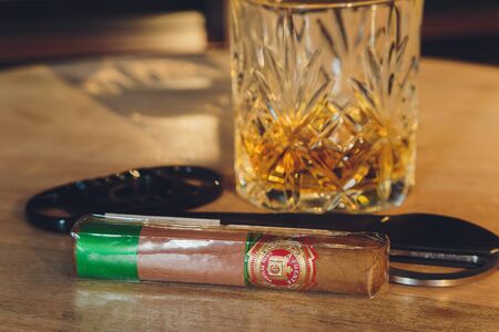 Ufa, Russia, 15 November, 2018: Whiskey drinks with cigars on wooden tableのeditorial素材