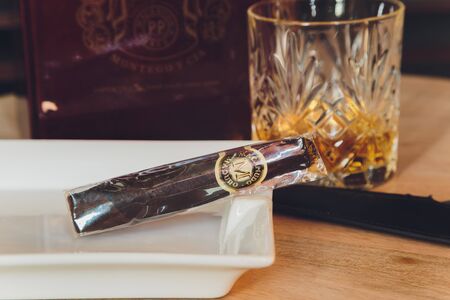 Ufa, Russia, 15 November, 2018: Whiskey drinks with cigars on wooden tableのeditorial素材