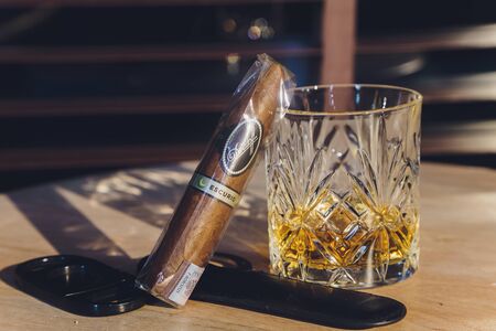 Ufa, Russia, 15 November, 2018: Whiskey drinks with cigars on wooden tableのeditorial素材